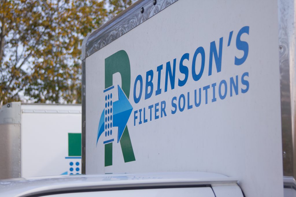 A picture of the Robinson's Filter Solutions logo on their industrial air filter cleaning and sales delivery truck