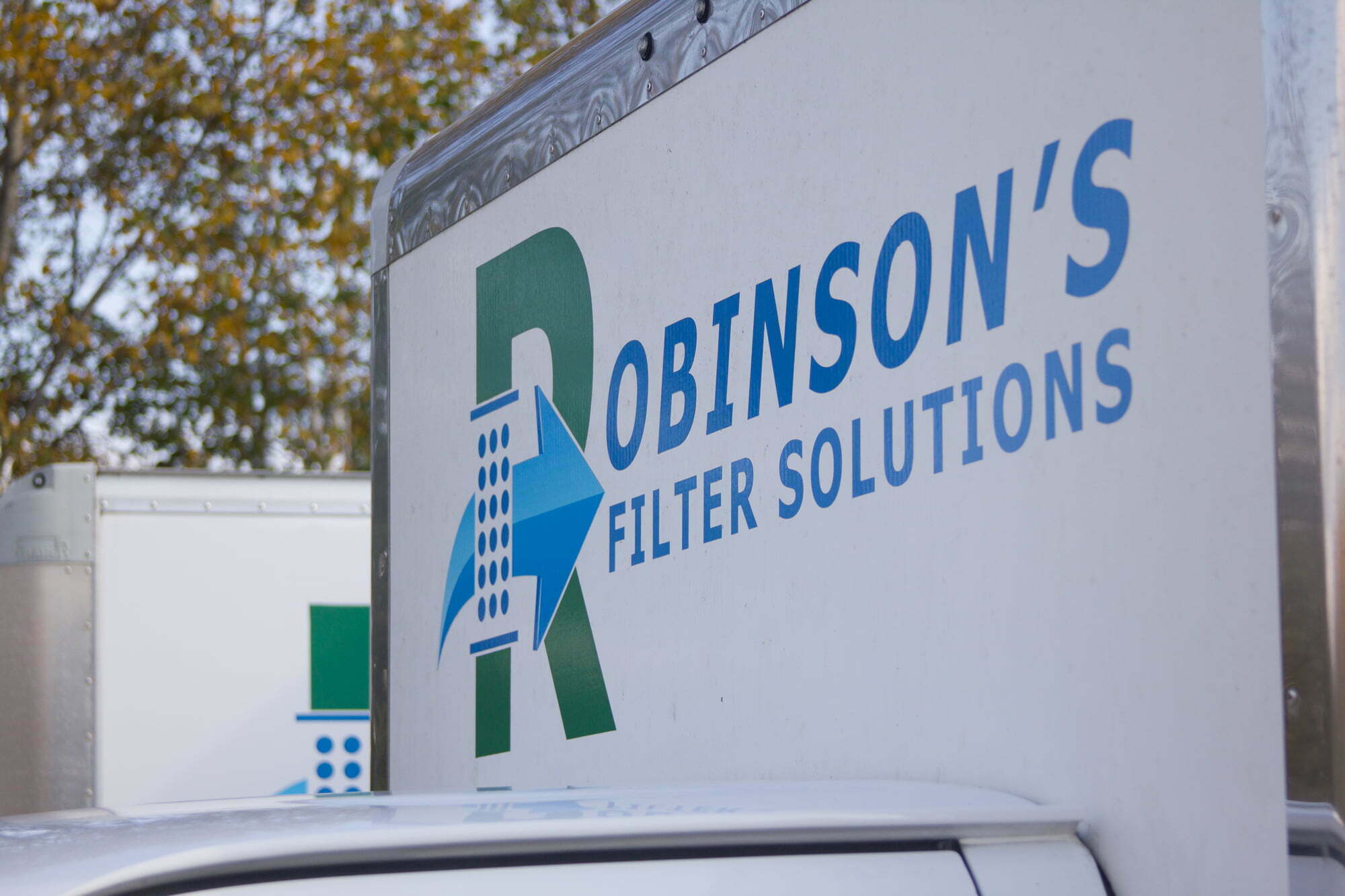 Industrial air filter cleaning and sales van with robinsons-fs.com printed on the back. 