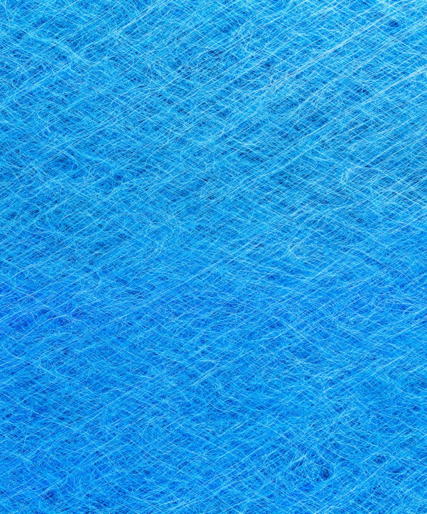 A close up of a blue paint booth filter
